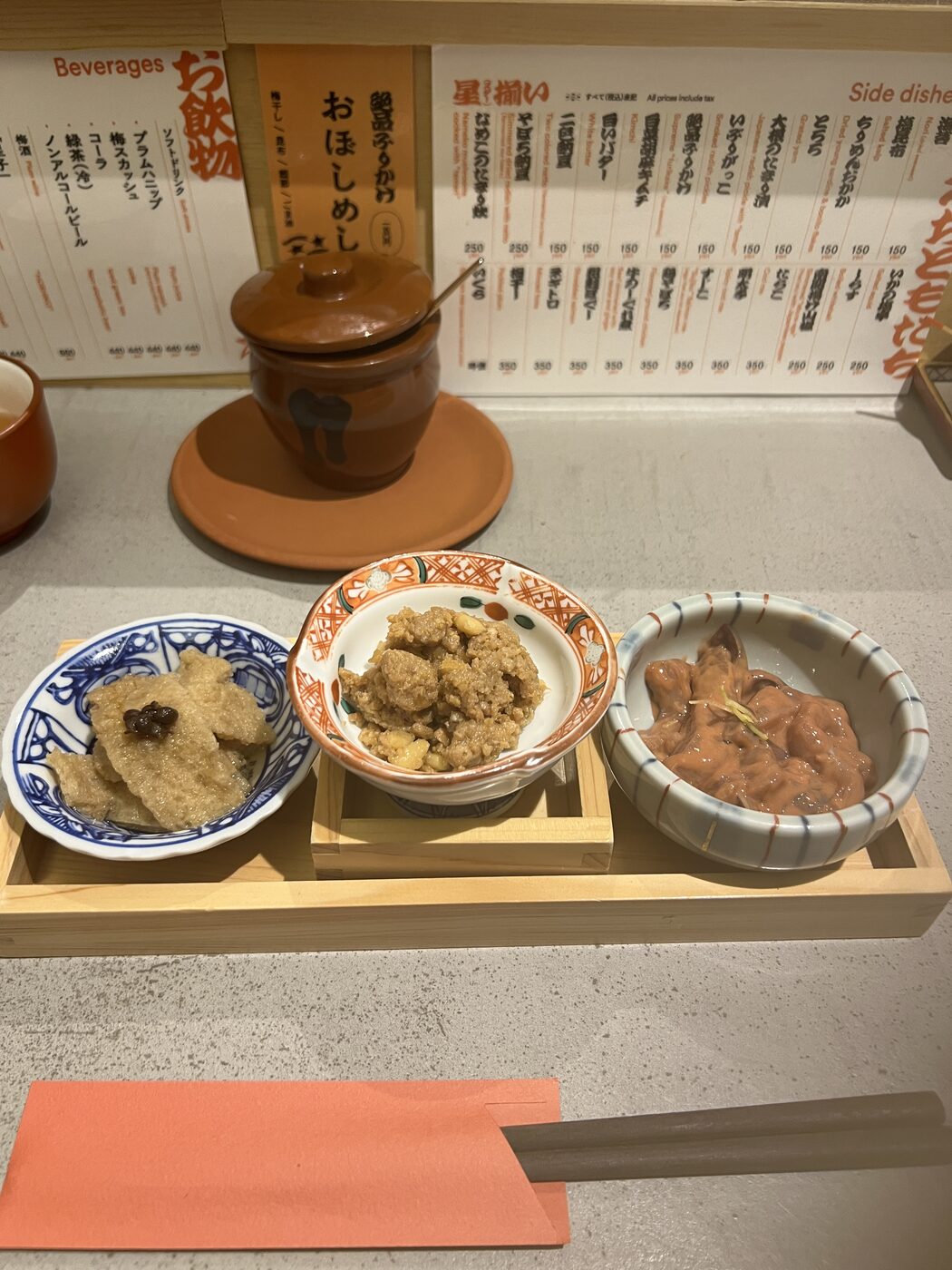 Three small rice toppings served on a wooden tray